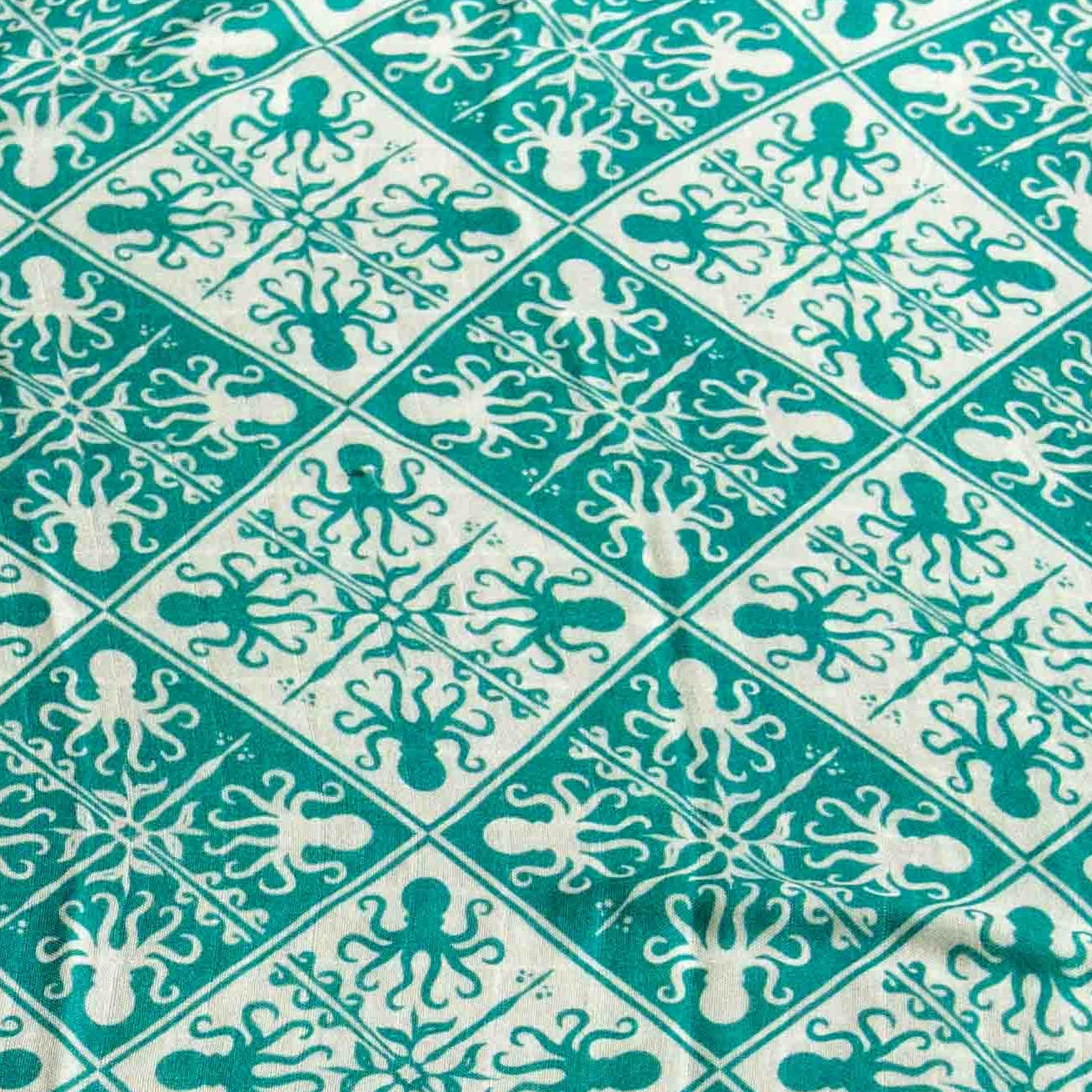 The Keiki Dept Teal Kuiki Heʻe Bamboo Muslin Swaddle Blanket