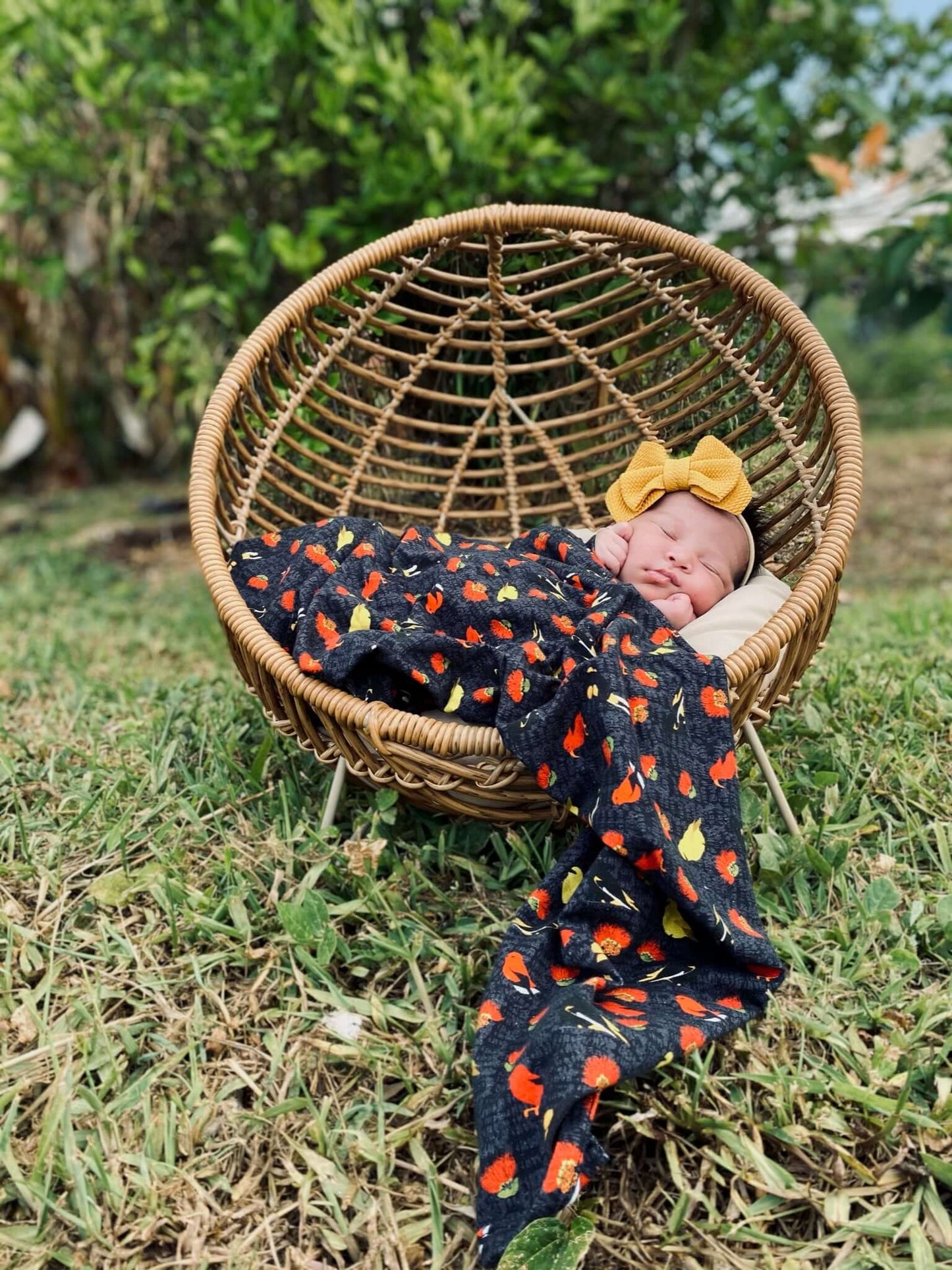 newborn baby girl sleeping under her kamanuailehua jersey blanket from the keiki dept