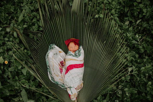 newborn photo with na lei o hawaii kapa moe swaddle blanket