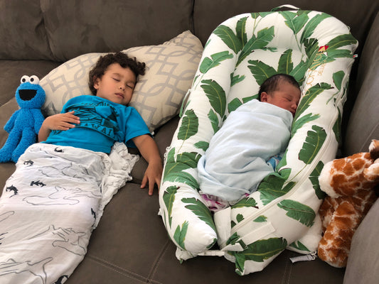 baby and toddler sleeping with dockatot