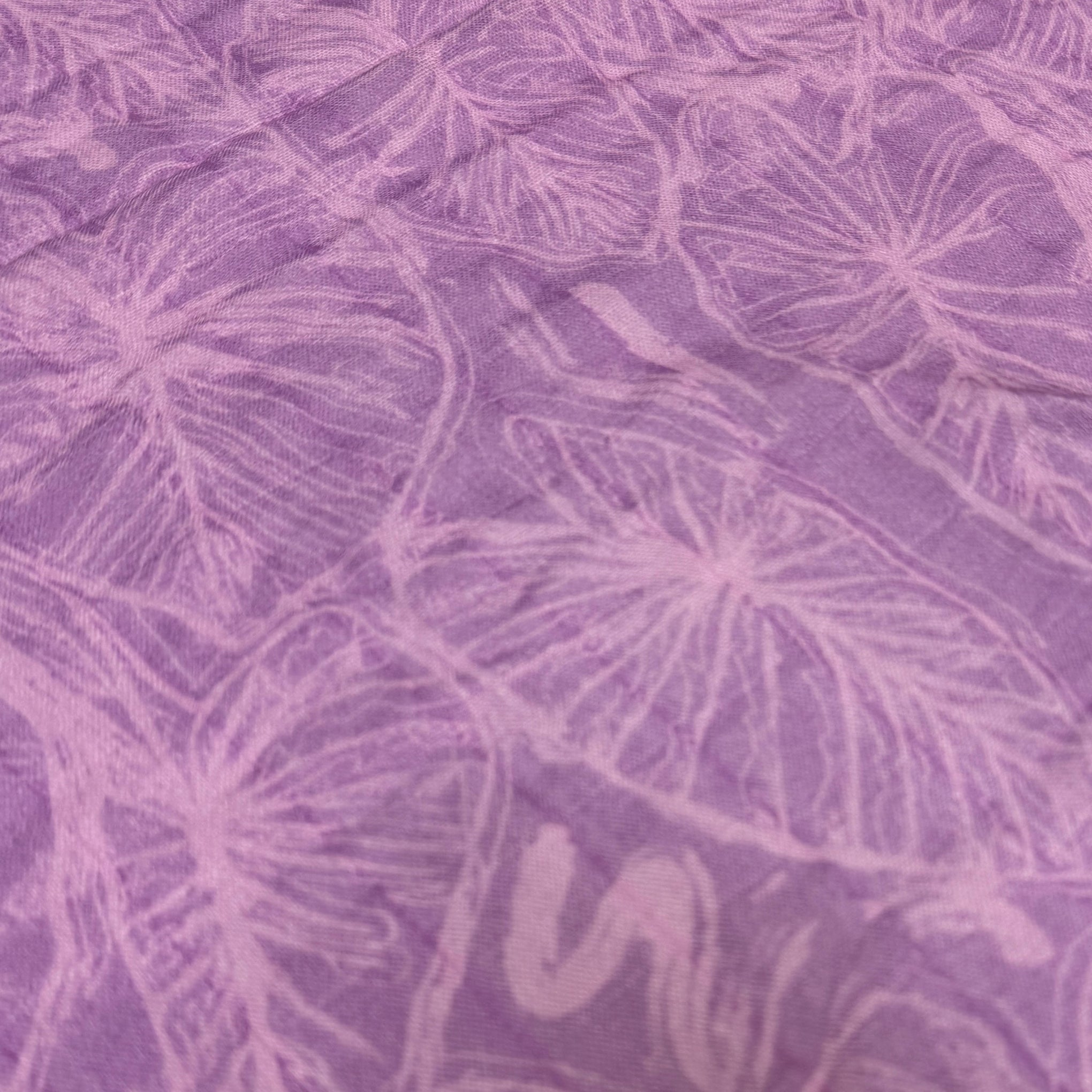 Purple fabric with a subtle kalo leaf pattern